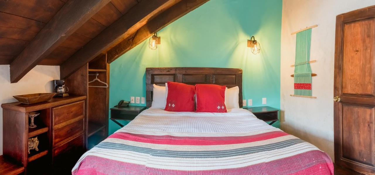 Yox Hotel Boutique San Cristóbal de Las Casas Kültér fotó A bedroom at the hotel