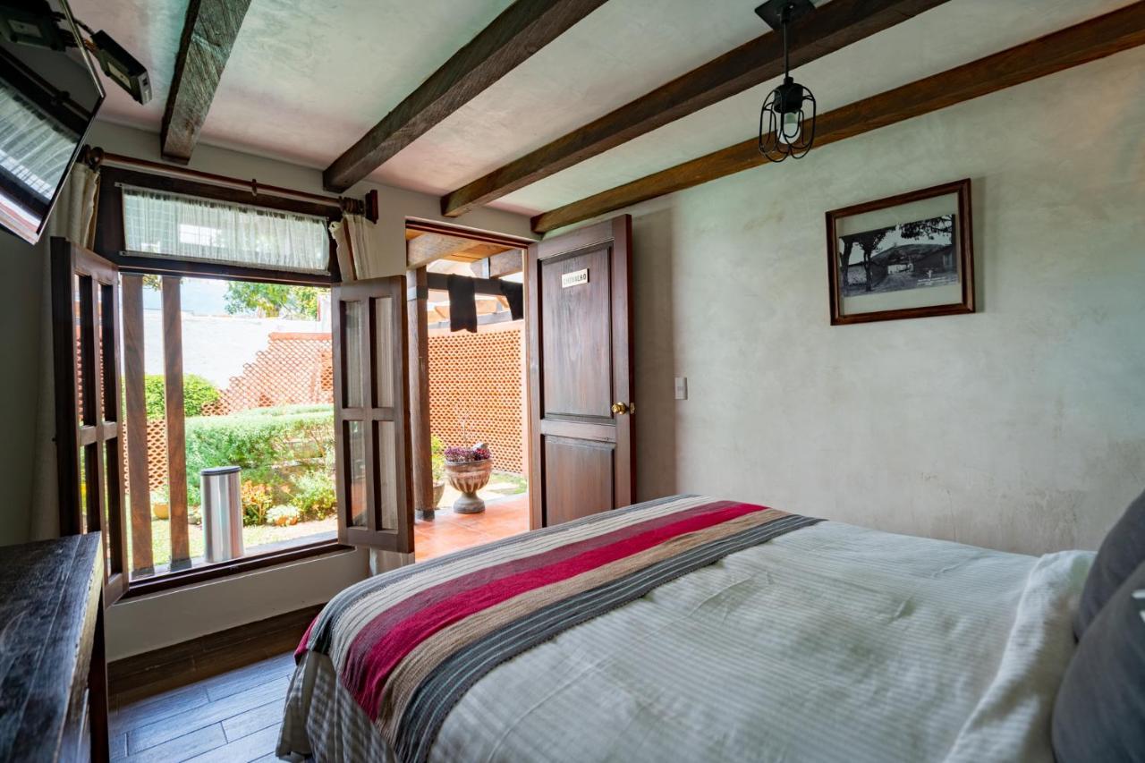 Yox Hotel Boutique San Cristóbal de Las Casas Kültér fotó A bedroom at the hotel